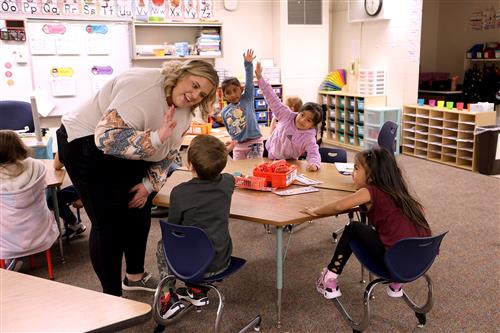 teacher giving student high five